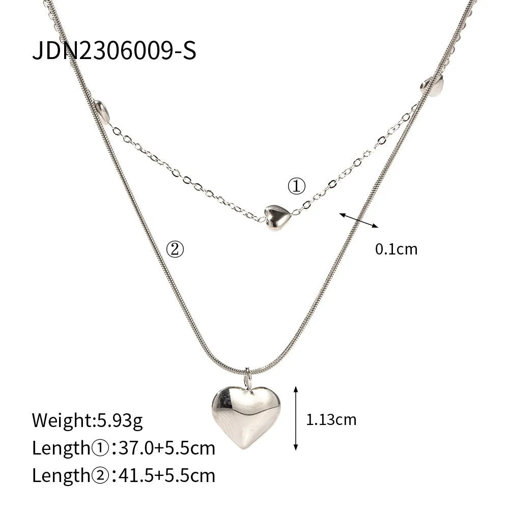 Love double-layer 18K gold-plated collarbone necklace with snake pendant for women on display