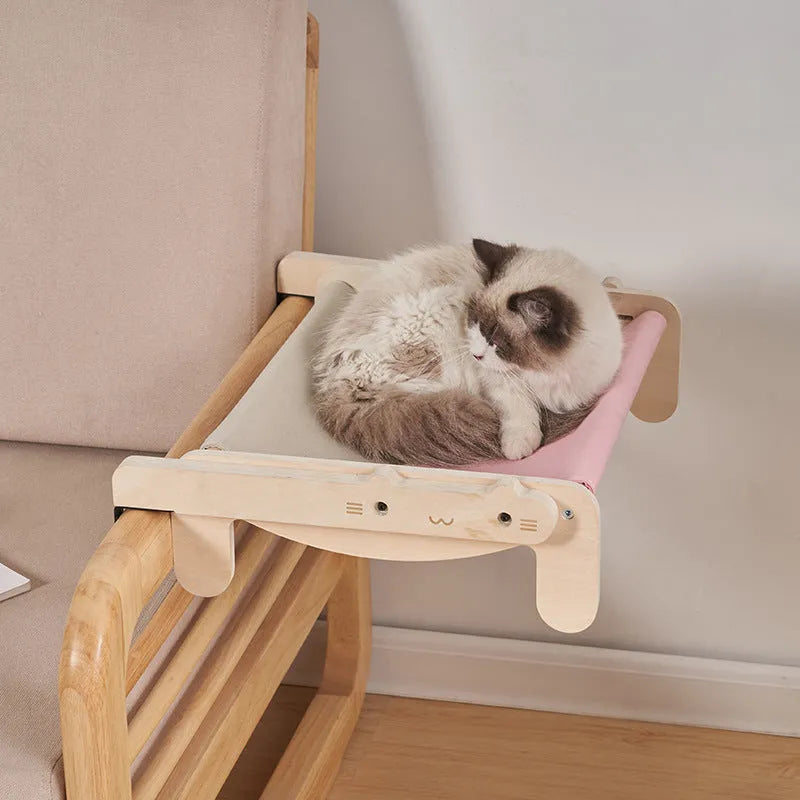 Solid wood cat bed with removable fabric in black and white plaid pattern