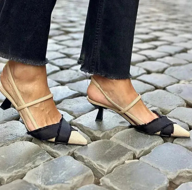 Apricot and black colour block women's stiletto sandals with a pointed toe and ankle buckle.