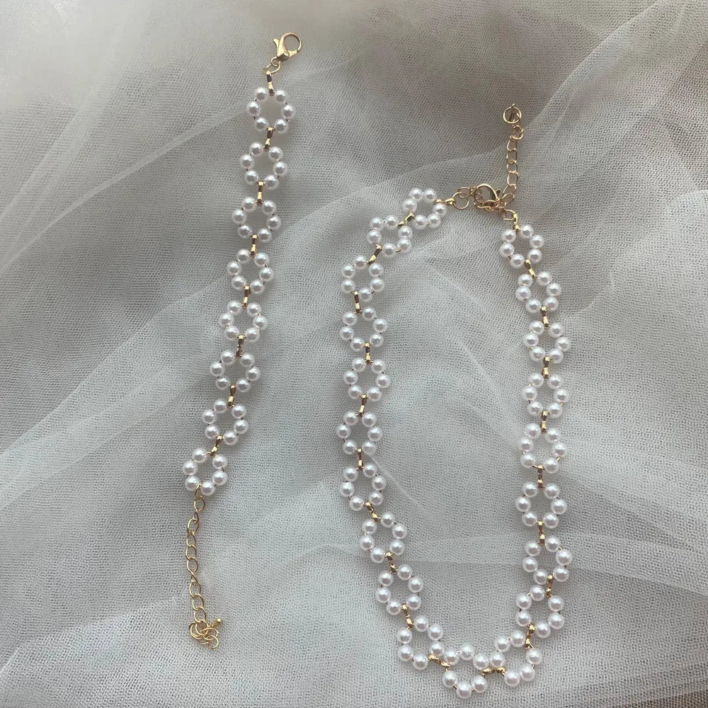 Pearl necklace and bracelet set for women on white background
