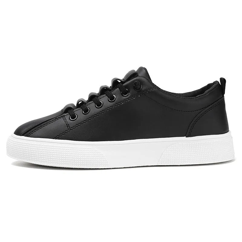 Men's black and white low top sports shoes with mesh panels and synthetic leather upper on a flat PVC sole.