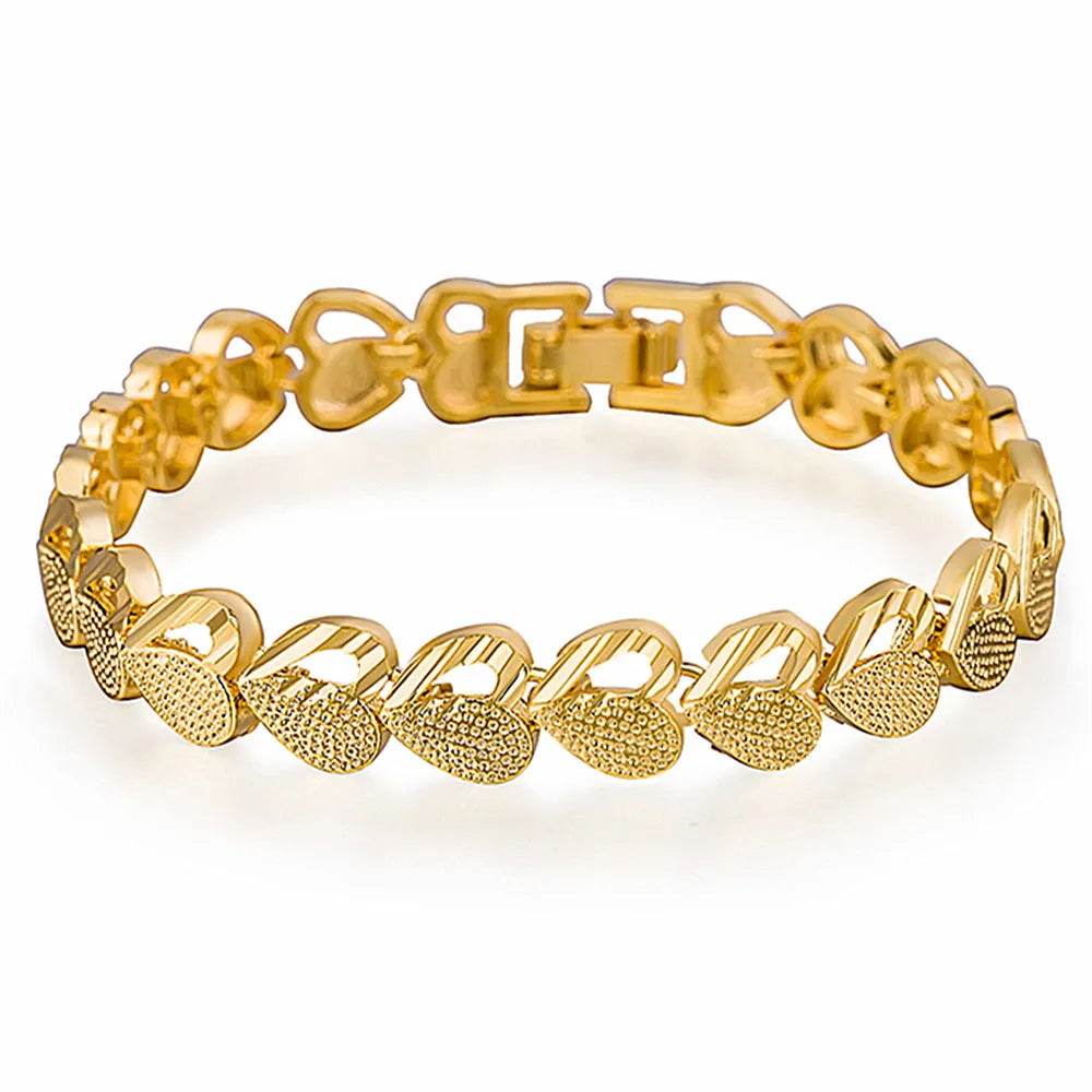 Gold-plated copper heart-shaped bracelet on neutral background showing 18.5cm length