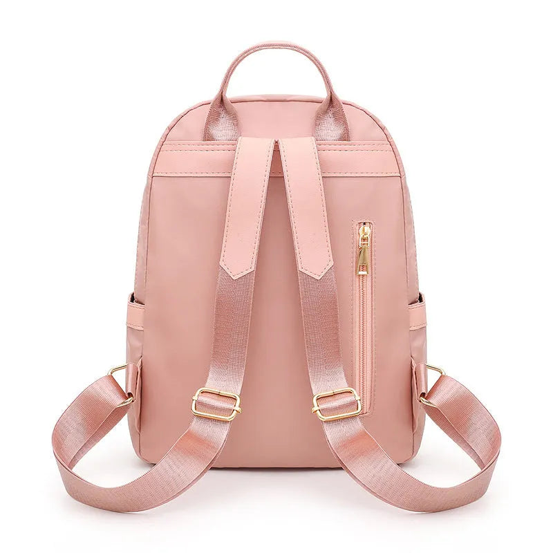 Women's black nylon backpack with anti-theft pockets and water-resistant finish.