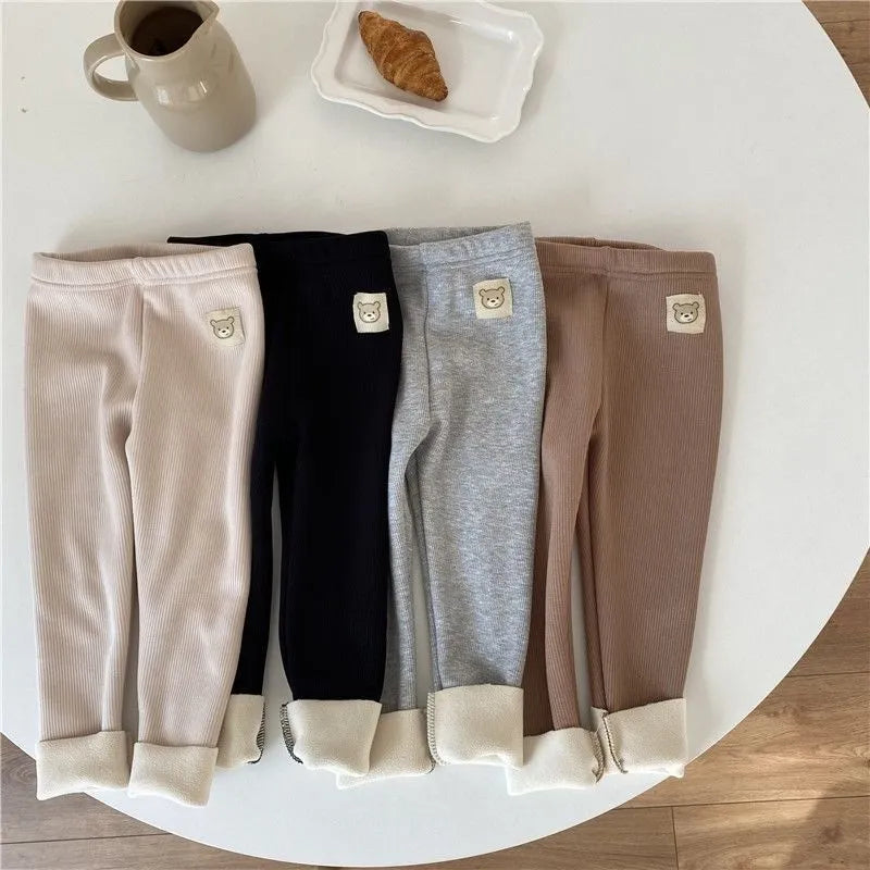 Girls' high-waist fleece-lined winter leggings in beige, black, brown, and grey with a hair band belt.