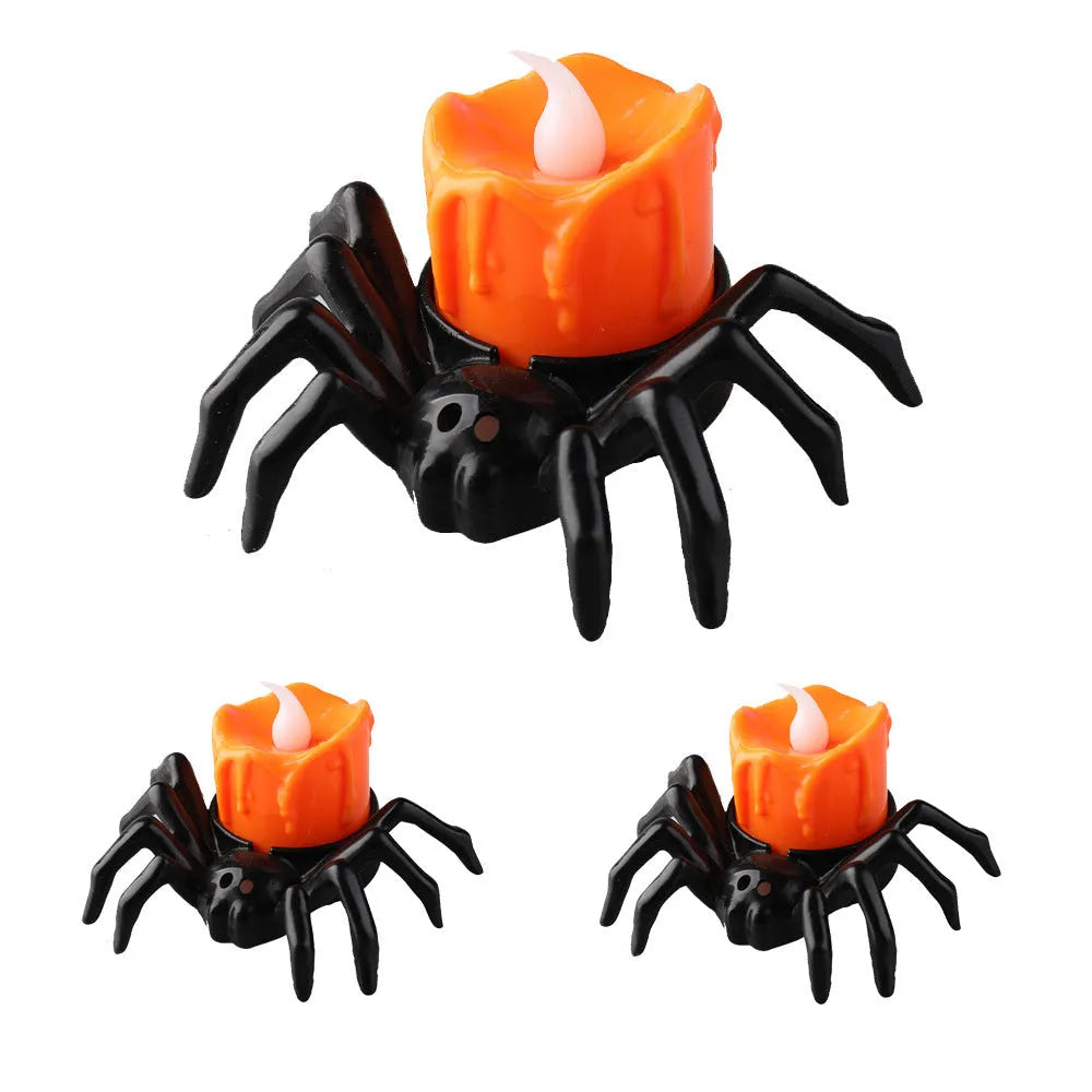 Plastic Halloween spider candlestick ornament with battery-operated candle light.