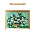 DIY paint-by-numbers kit showing canvas, acrylic paint pots, and brushes for recreating Van Gogh's Starry Night.