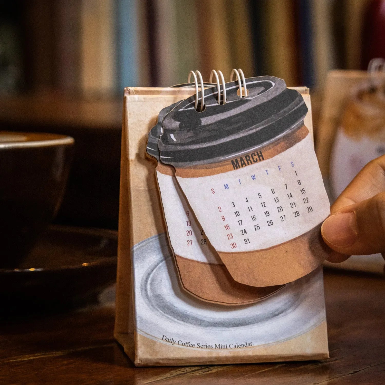 Mini desk calendar 2025 with four themed paper designs including coffee time model
