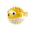 Green fish-shaped interactive dog toy with textured surface for treat dispensing and chewing.