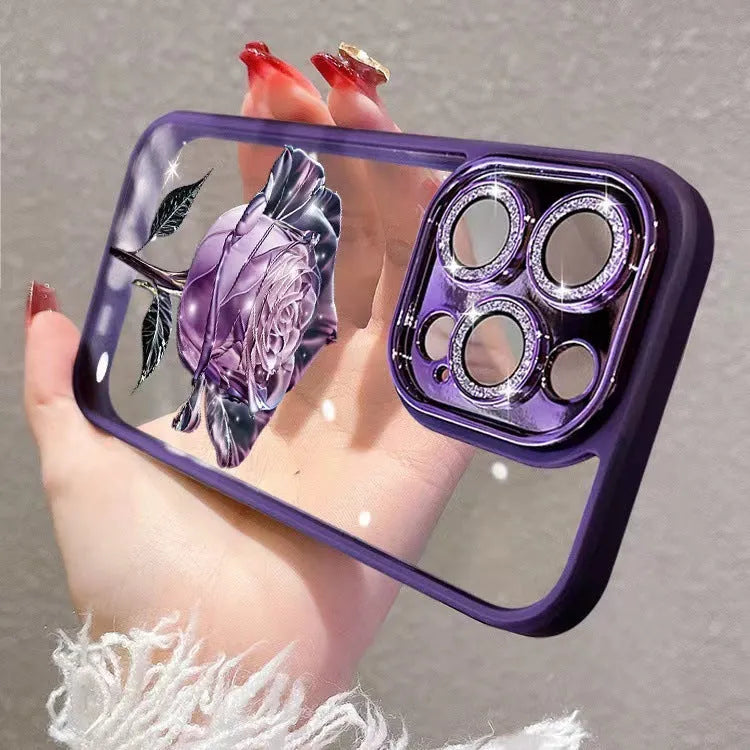 Dark purple TPU iPhone case with pink rose design and sparkling pink lens film over cameras.