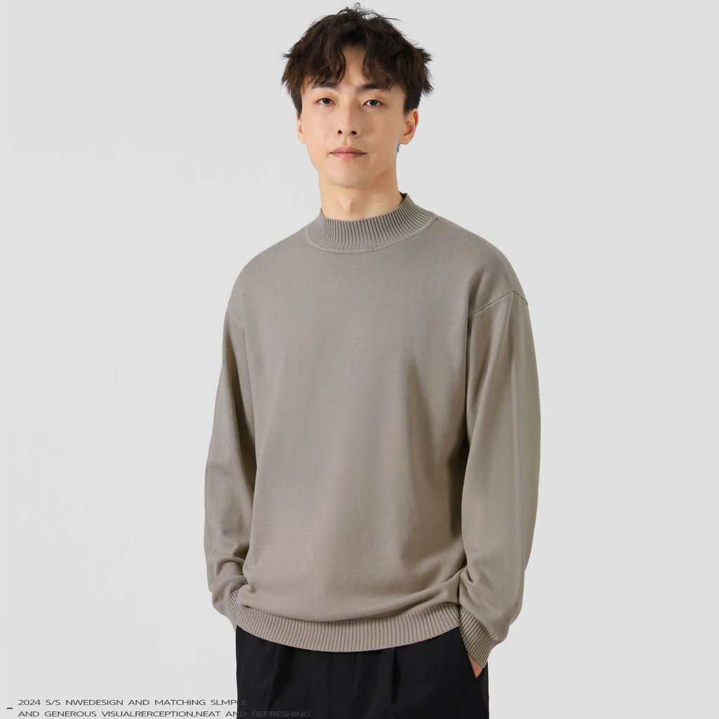 Man wearing a loose-fit army green long-sleeved pullover sweater for casual wear.