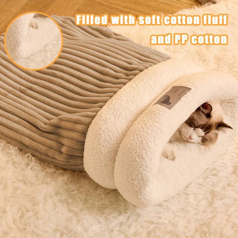 Brown semi-enclosed lambswool pet sleeping bag for cats on a wooden floor.