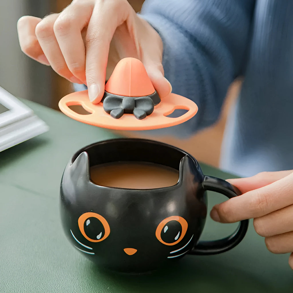 Black ceramic cat-shaped mug with pumpkin decoration and optional spoon lid, 355ml capacity.