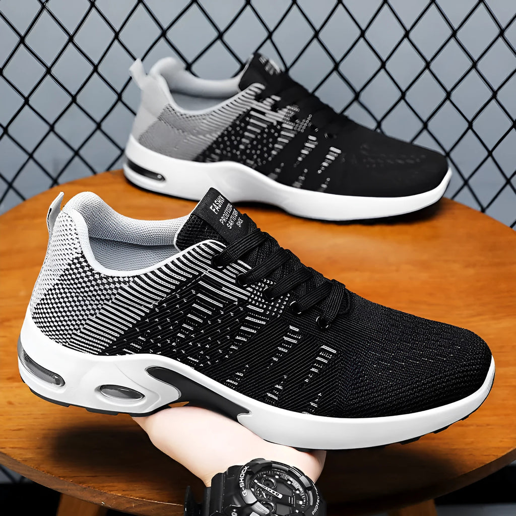 Men's black and grey Flyknit mesh sneakers with soft sole and lace-up design