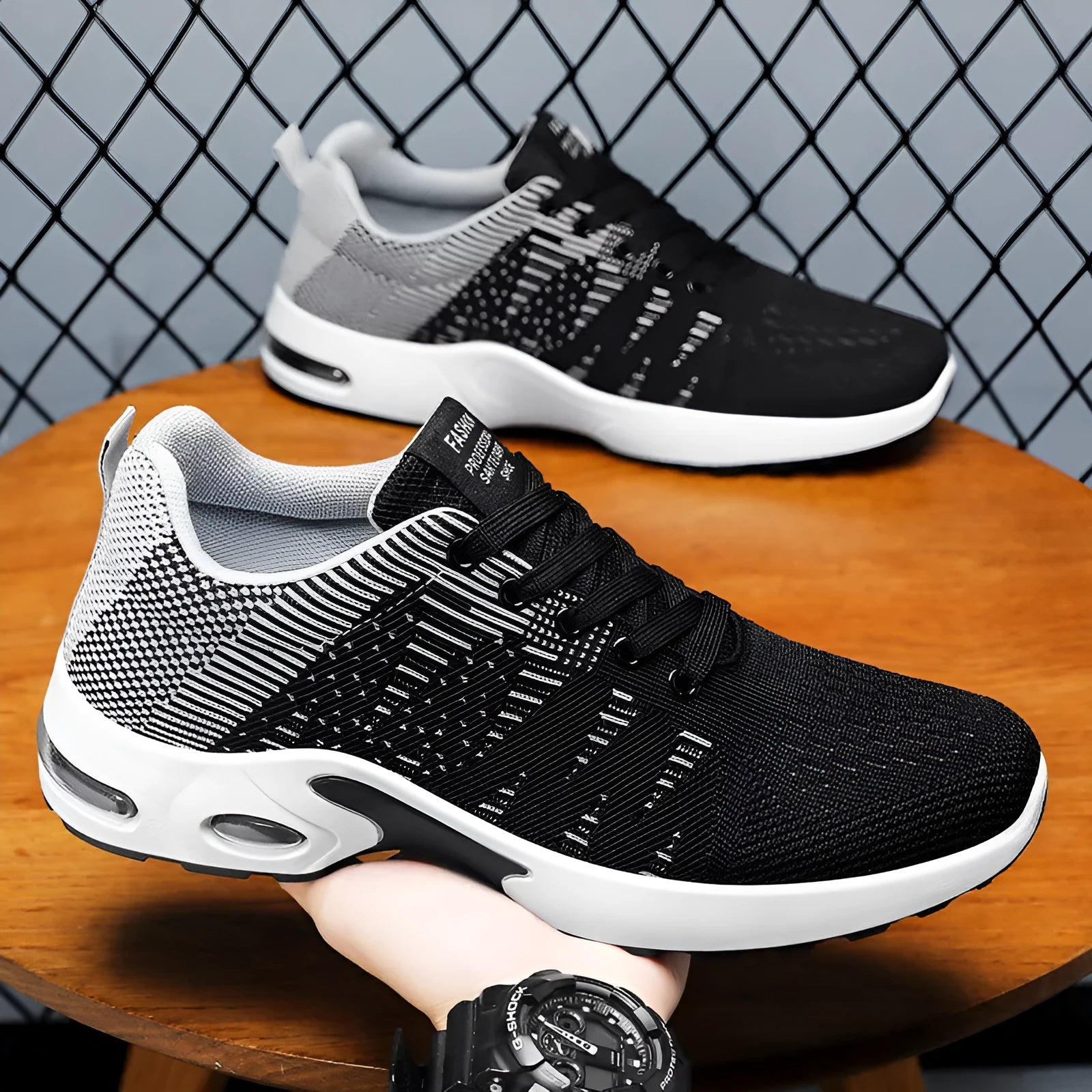 Men's black and grey Flyknit mesh sneakers with soft sole and lace-up design