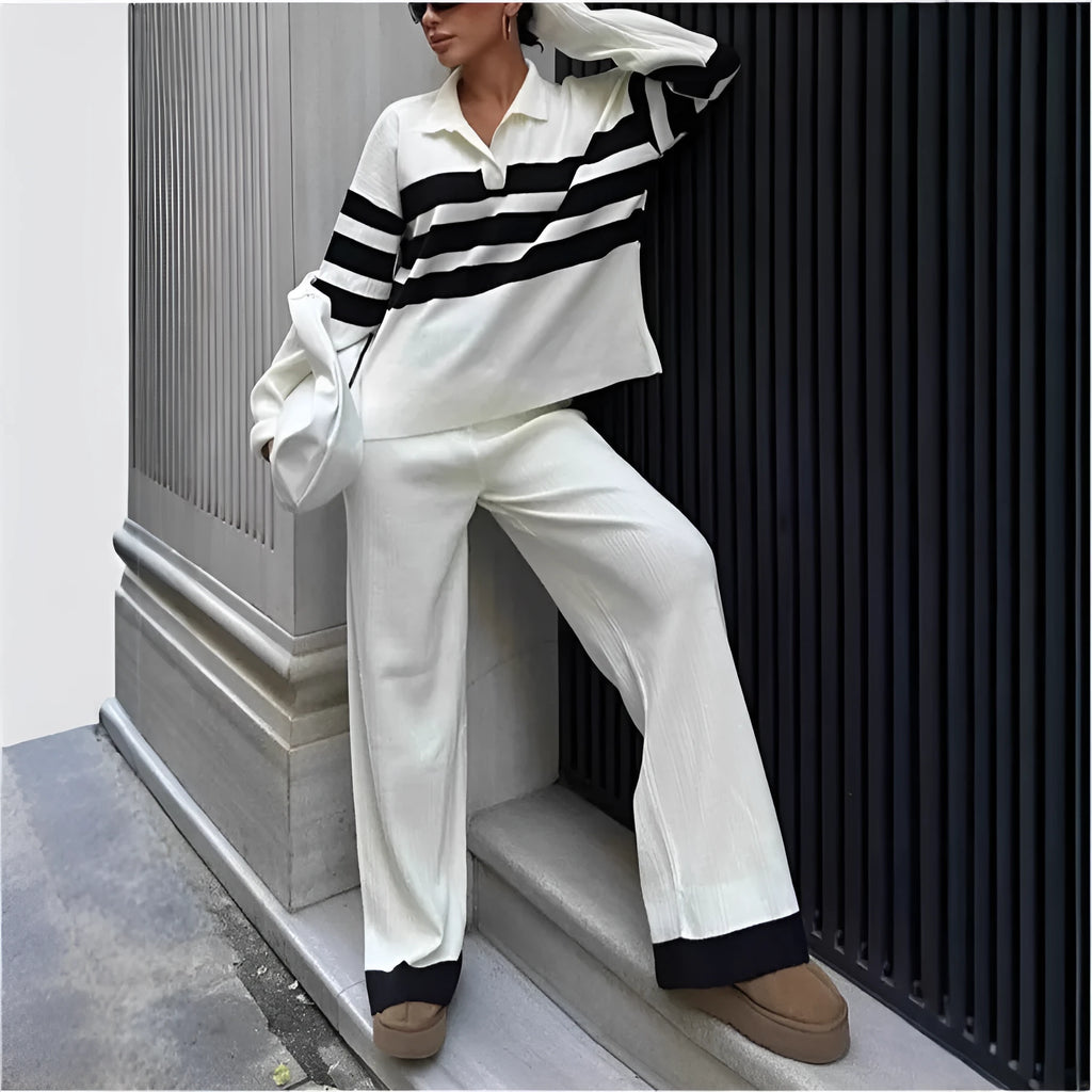 Women's black and white striped polo collar knitted top with matching trousers, a casual two-piece set.