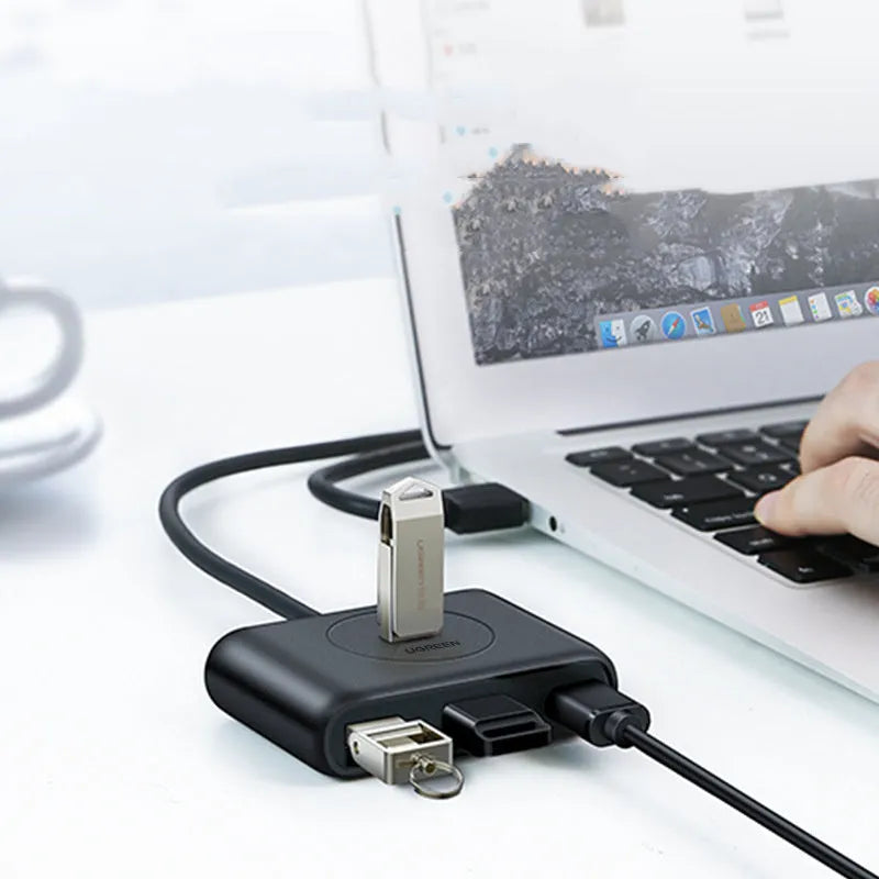 Black USB 3.0 extender adapter set with a multi-port hub and a choice of cable lengths on a desk.