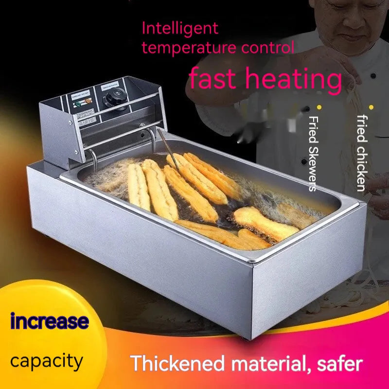 Stainless steel commercial deep fryer with large oil tank, lid, and two wire frying baskets