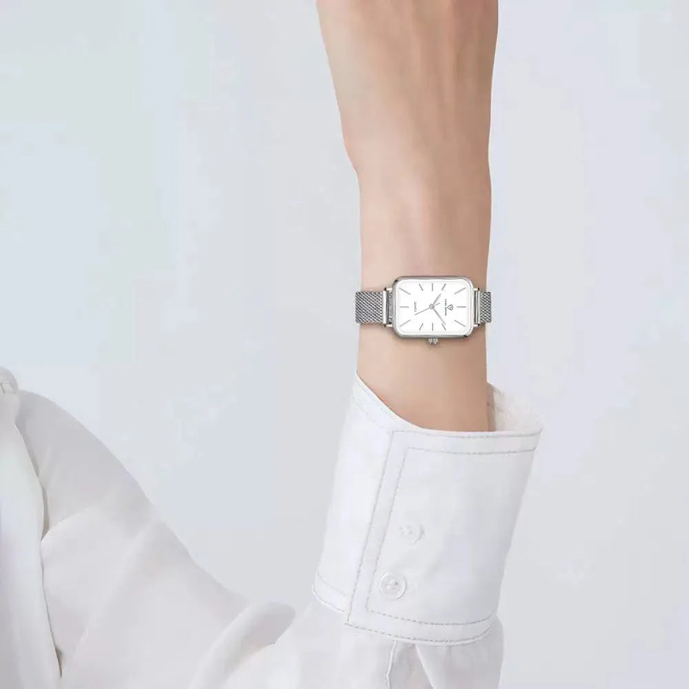 Women's rose gold waterproof quartz watch with woven steel strap and alloy case.