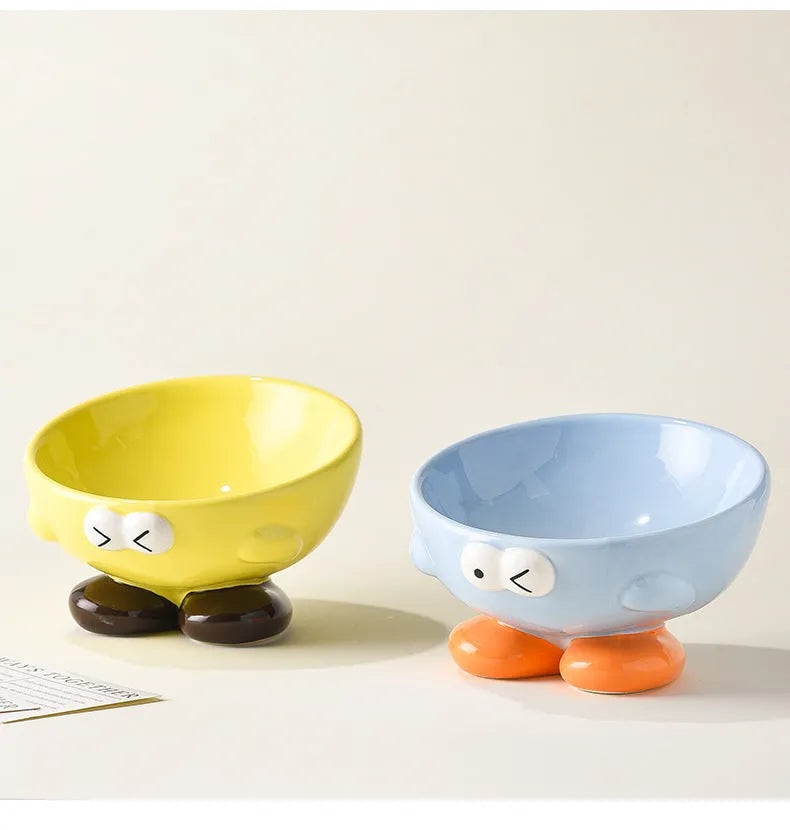 Ceramic pet bowl with oblique design and cute expressions for cervical spine protection
