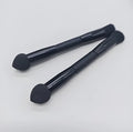 Double-headed miter sponge concealer brush with black artificial fibre bristles on wooden handle