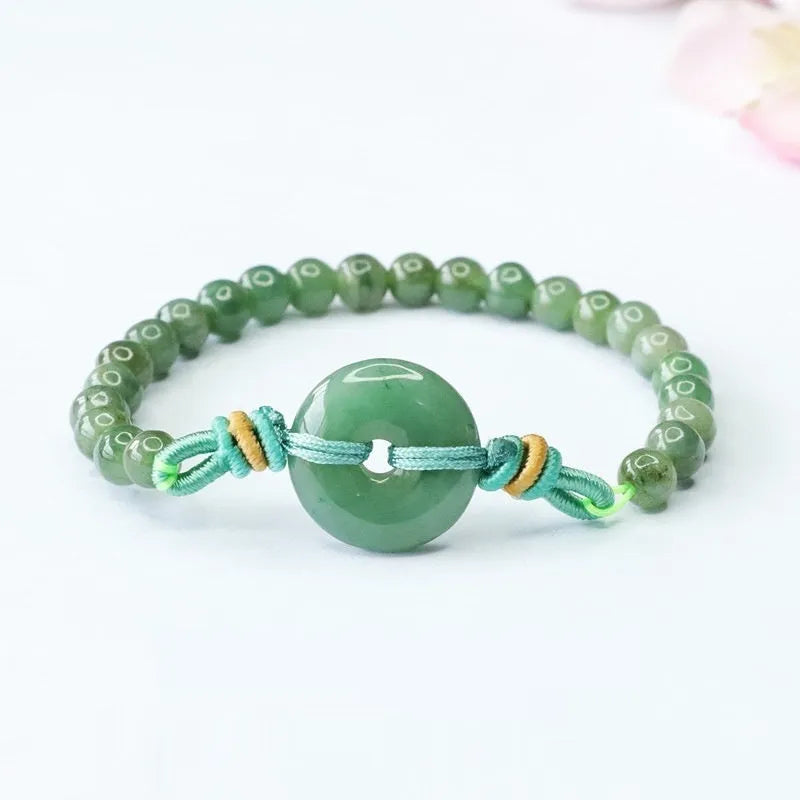 Oil green jade bracelet with safety buckle closure showing star-shaped 6mm beads