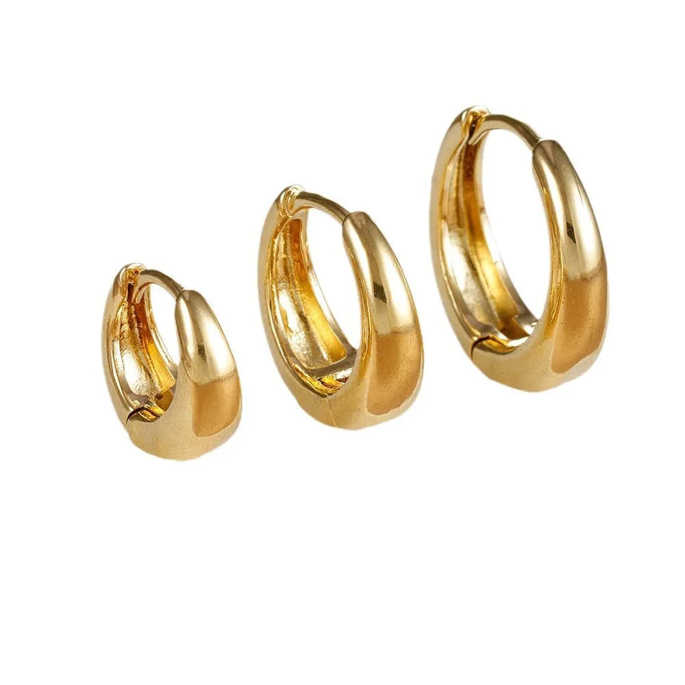 Geometric copper earring set of 3 glossy gold electroplated round shape earrings on display