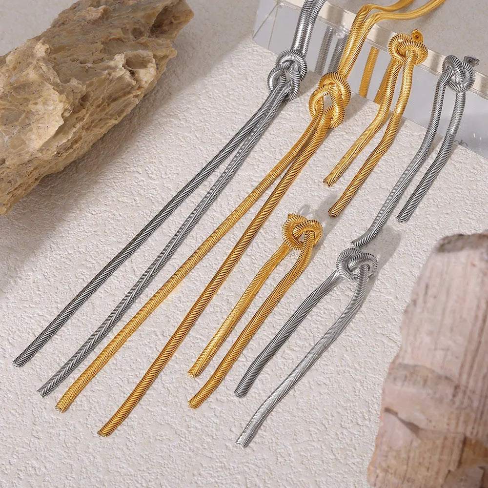 Gold electroplated titanium steel necklace with knotted tassel pendant and matching earrings set