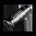Black plug-in GPS car tracker with magnetic base, shown inserted into a vehicle's 12V lighter socket.
