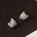 Geometric platinum-coloured zircon earrings for women on a white background.