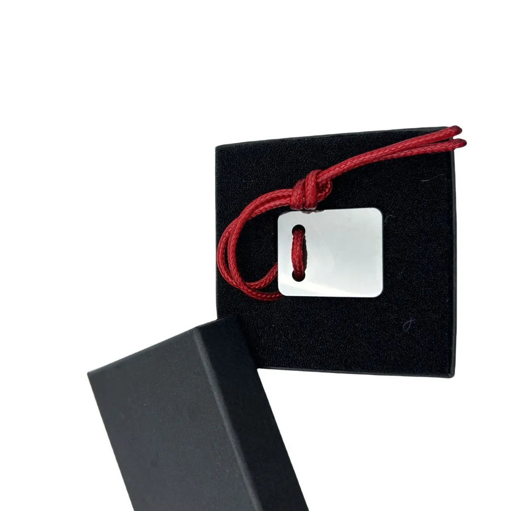Silver-coloured metal car paint repair scraper tool for vehicle scratch and dent touch-ups.