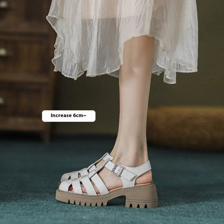 Women's black retro platform sandals with chunky heel, hollow out design, and a buckle fastening.