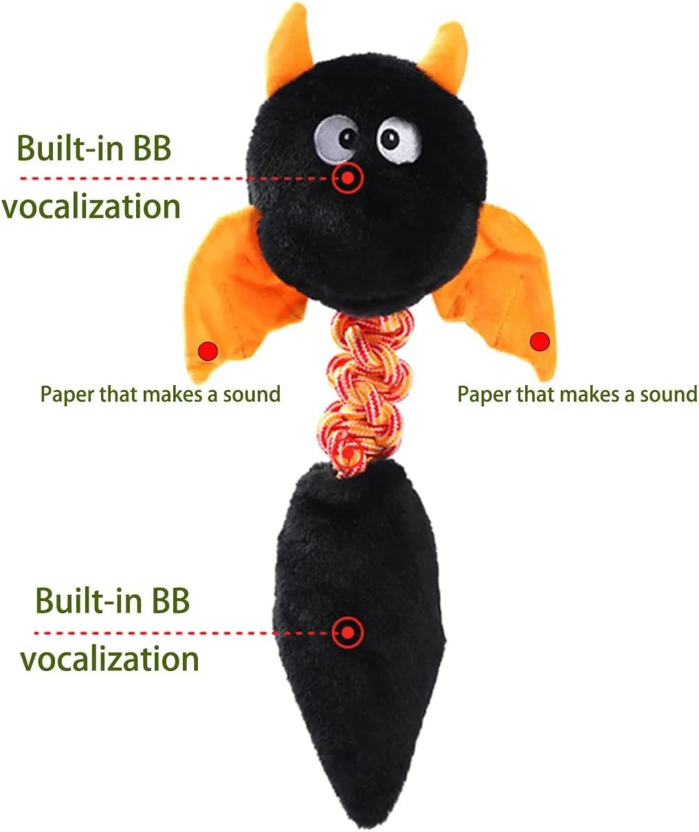 Large black plush dog toy with cartoon design, featuring a squeaker, rattle, and an elastic rope knot for chewing.