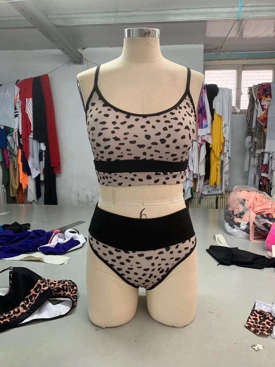 Women's high waist split leg bikini swimsuit in leopard print and white colour options.