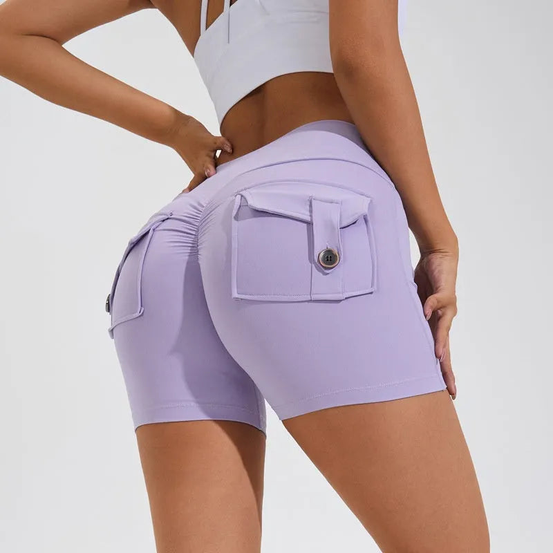 Women's high waist hip lifting shorts in electric blue colour with pockets for fitness activities