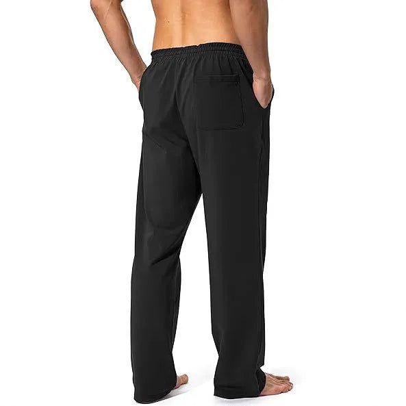 Men's loose casual trousers in black polyester fabric for sports and leisure wear