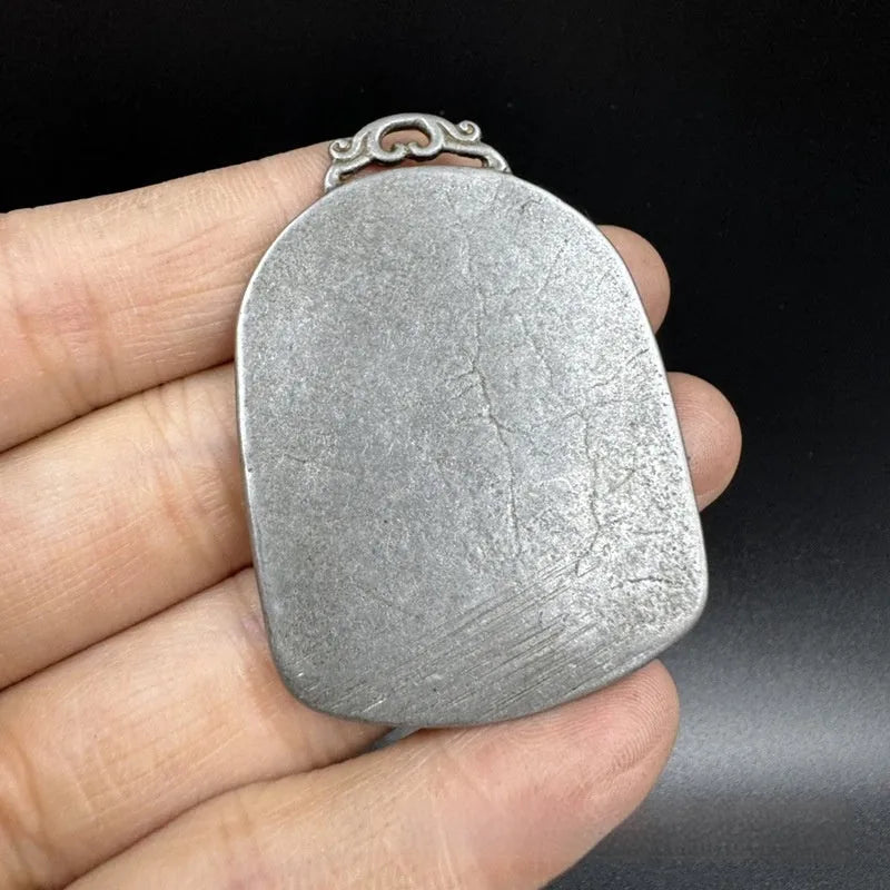 Antique-style iron pendant with Chinese geometric design, a hanging metal ornament.