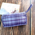 Square canvas stationery bag with double-layer storage compartments in red grid pattern