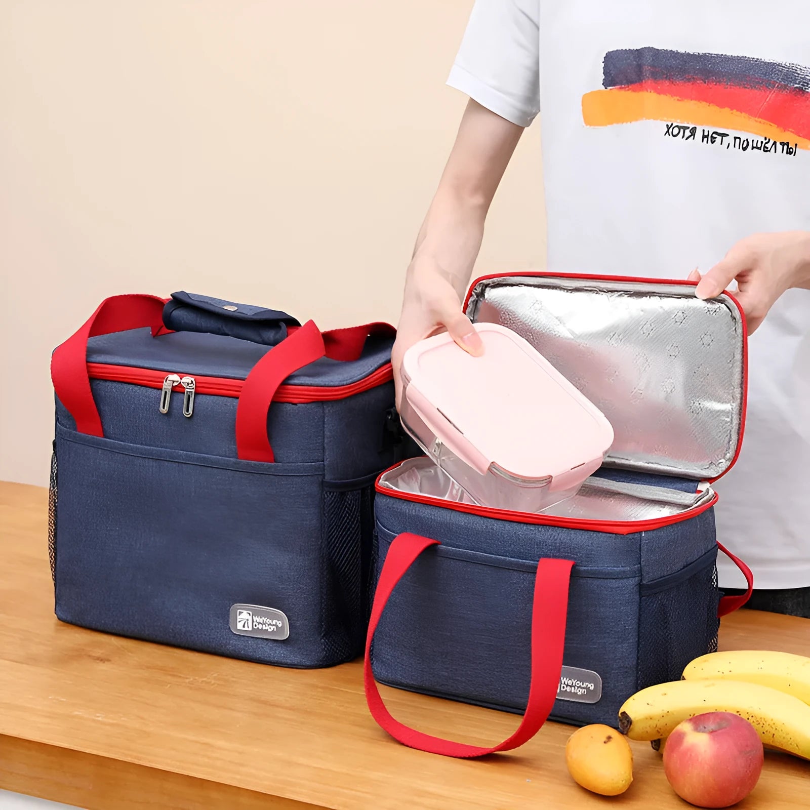 Grey insulated crossbody picnic bag with shoulder strap and 15 litre capacity.