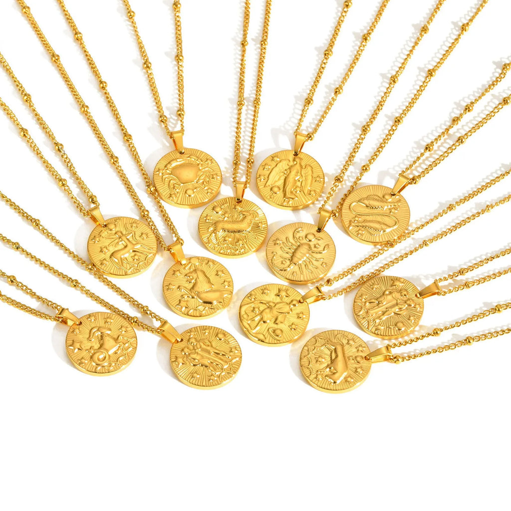 Stainless steel cross chain necklace with a geometric round bead pendant embossed with a zodiac constellation design.