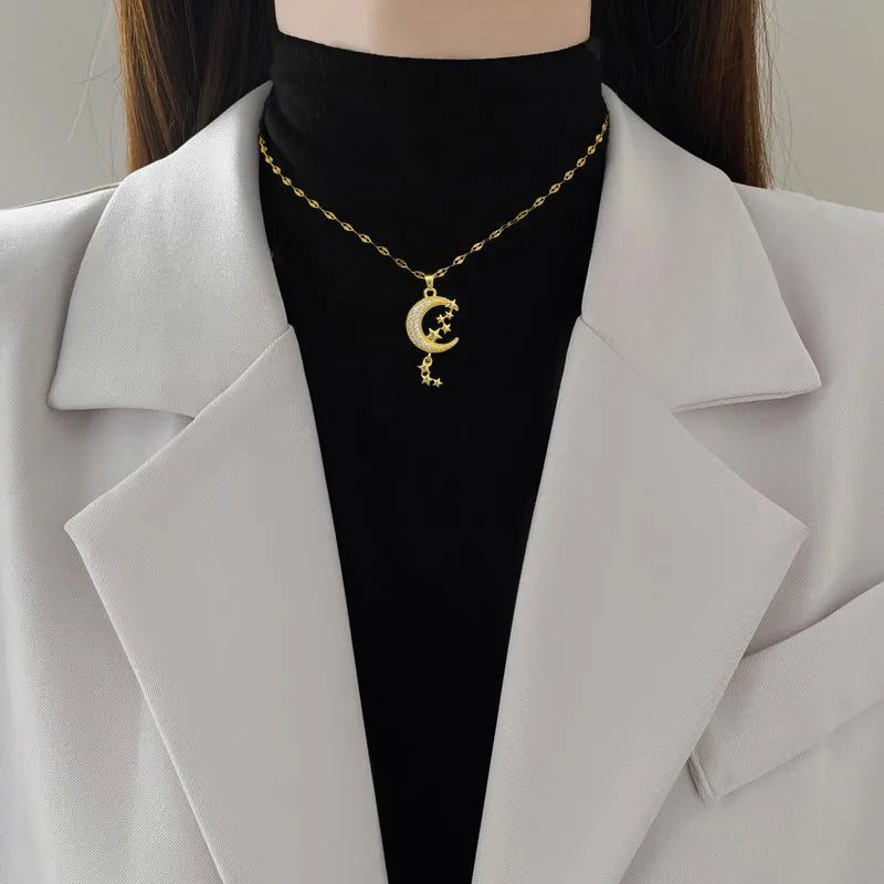 Moon Tassel Necklace with diamond-set copper pendant on a stainless steel chain.