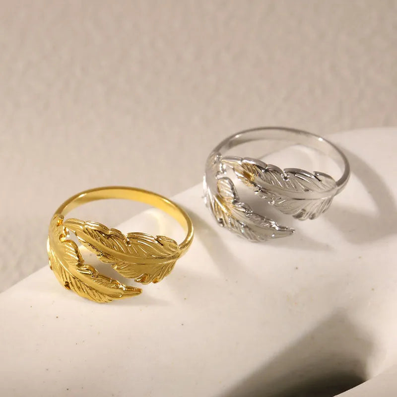 Women's stainless steel feather ring with adjustable opening in gold or silver finish
