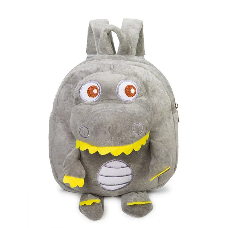 Soft blue plush children's backpack with an embroidered dinosaur character and a soft handle.