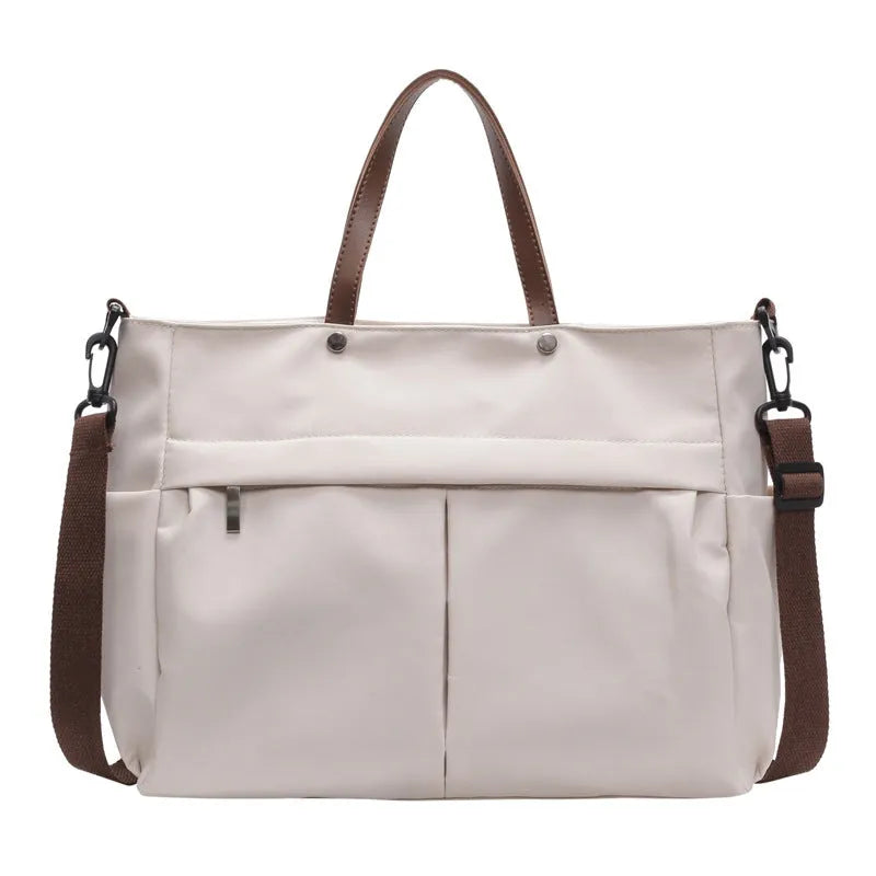 Nylon crossbody tote bag in black grey white green colours showing dimensions 39x28cm