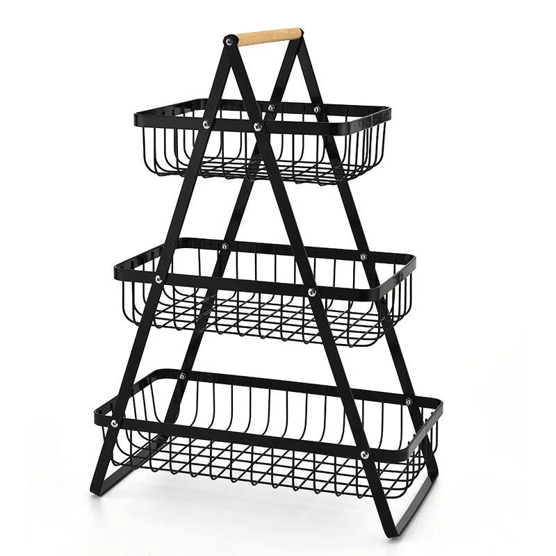 Black detachable iron double-layer fruit basket with a wooden carry handle on a tabletop.