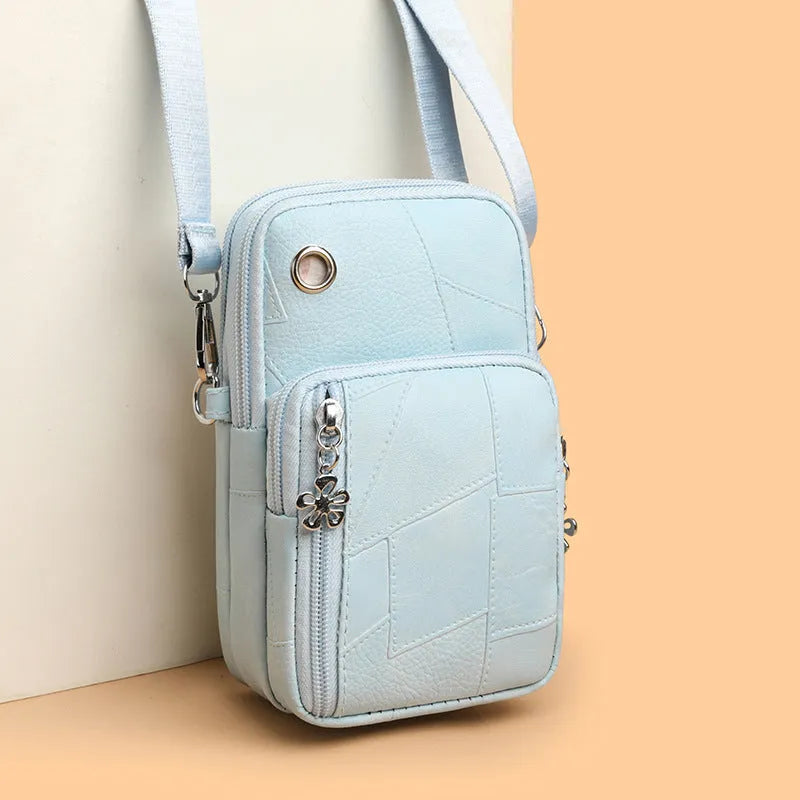 Vertical square mini phone bag in four colour options with sandwich pocket design