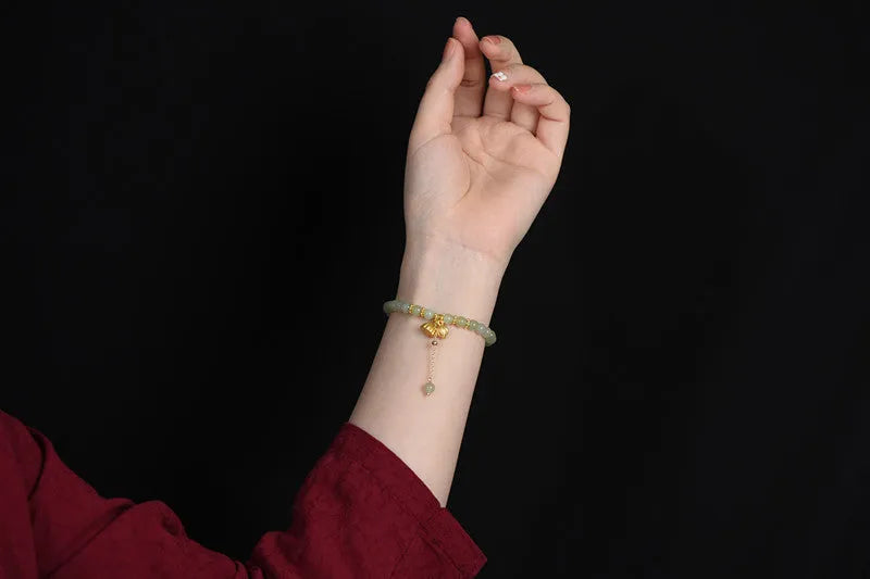 Two Shihuan natural Hetian jade bracelet with 6mm beads showing lotus and fu character designs