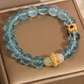 Blue crystal bracelet with Chinese style design featuring cube sugar colourful crystals