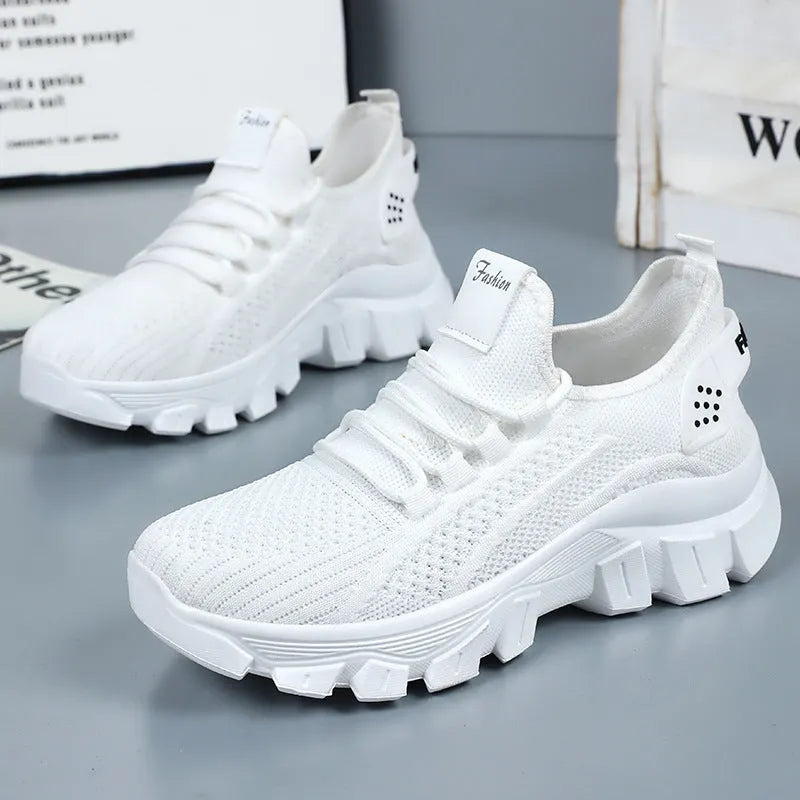 Women's Flyknit sneakers in white colour with round toe and lace-up front