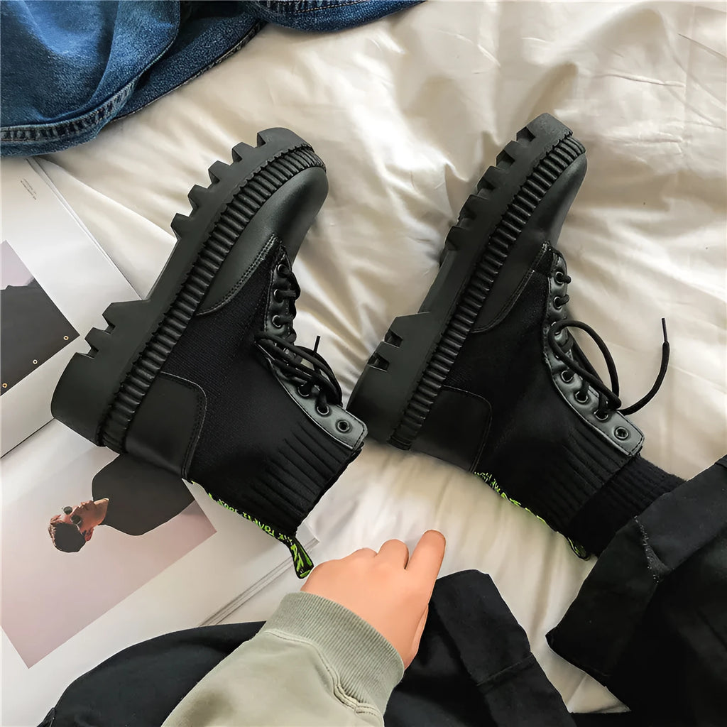 Men's black platform Doc Martens boots with side zipper and frosted cowhide upper, showing 8-hole high-top design.