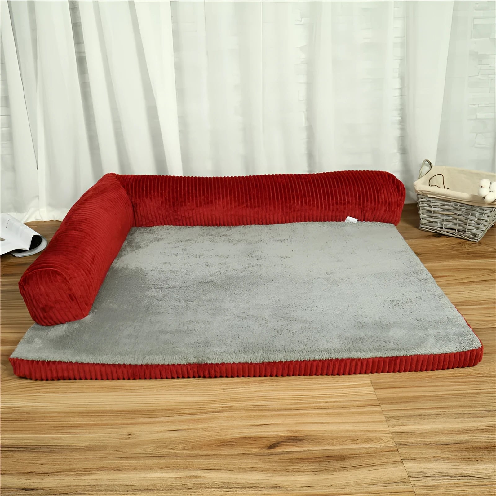 Corduroy pet dog sofa with bolster sides on a non-slip cloth base, shown in grey colour.